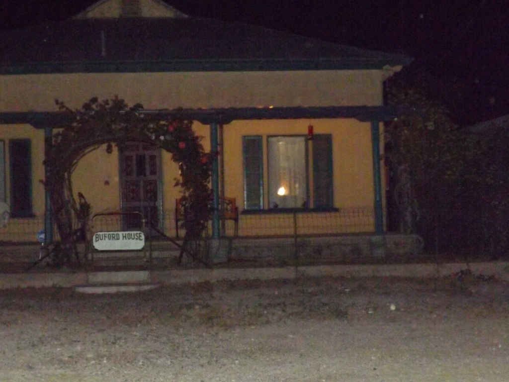 White apparition visible at the right edge of the Buford House porch