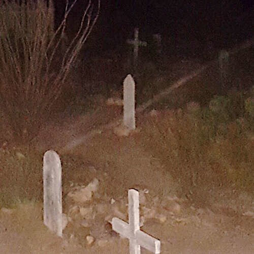 Vortex appearing as a sharp streak of light across graves at Boothill Graveyard